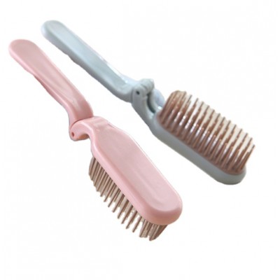 Foldable portable travel comb with soft teeth carries with it a dual brush for straight curls